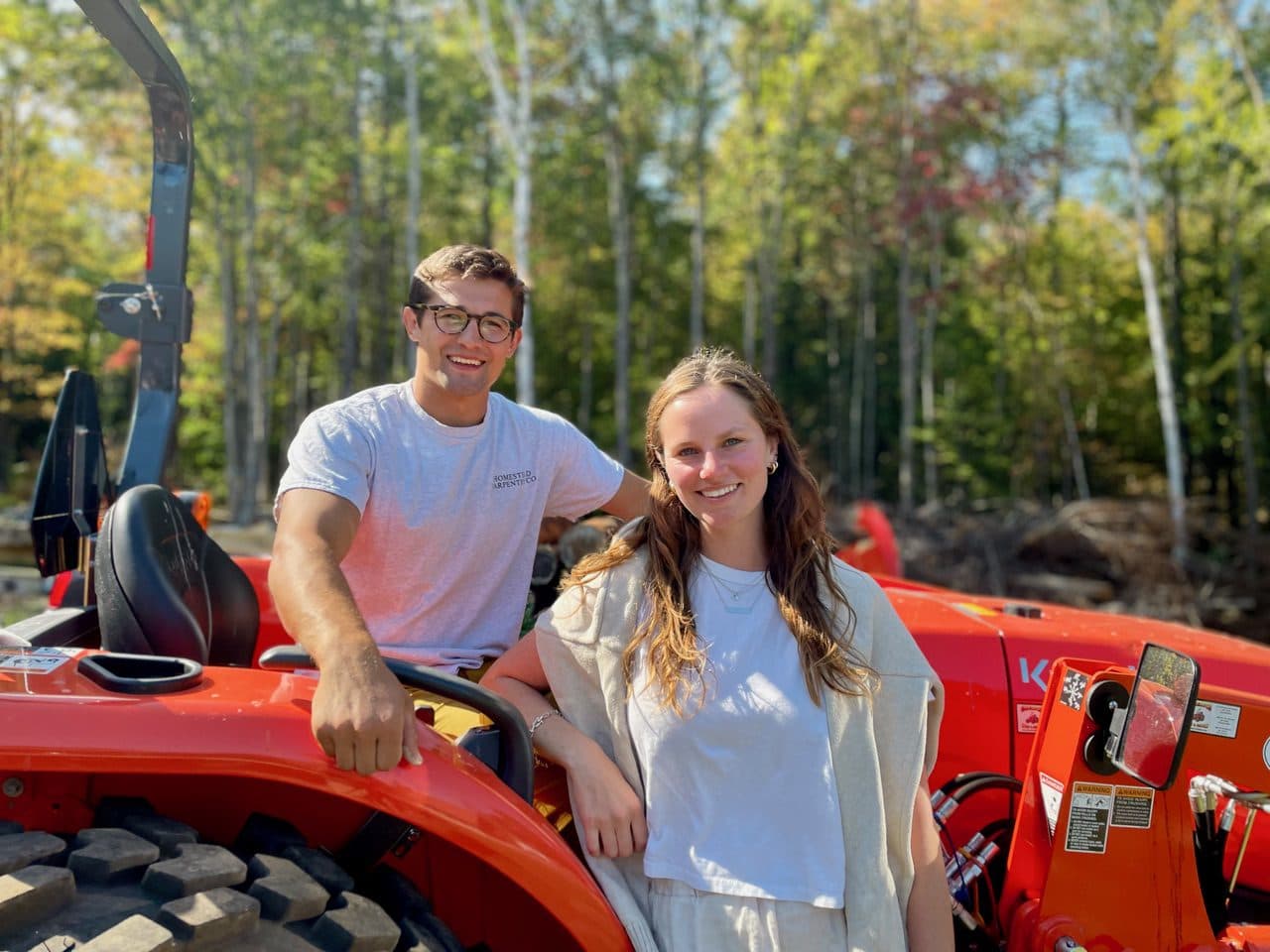 Man and Woman by a Red Tractor