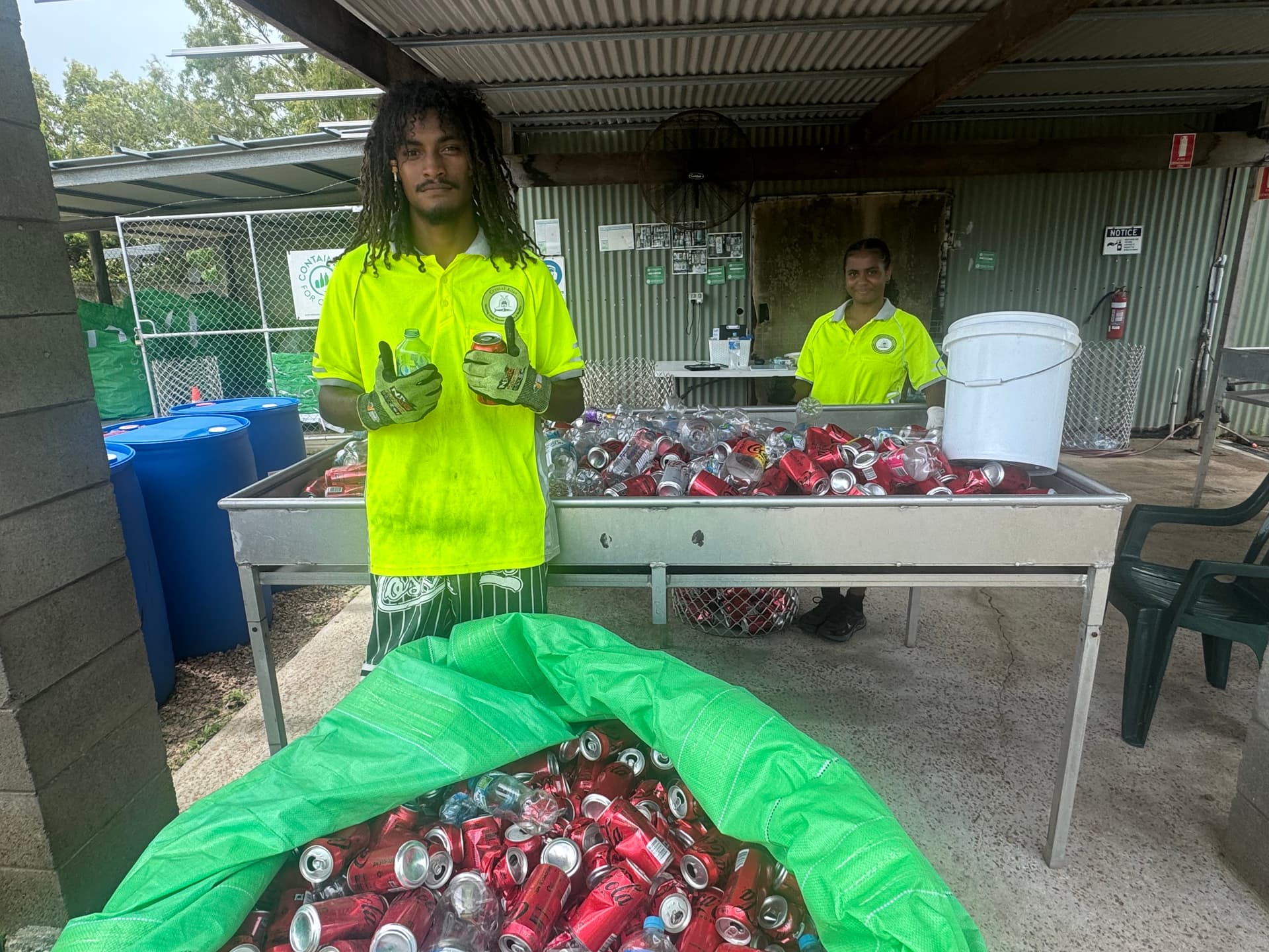 Yungurra Stow and Sofia Nona sorting bottles and cans